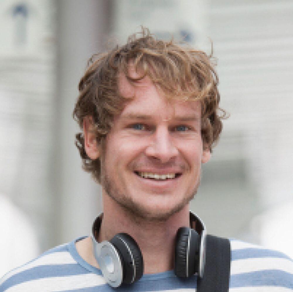 portrait of smiling man with headphones and should PFC5HDP 1 1